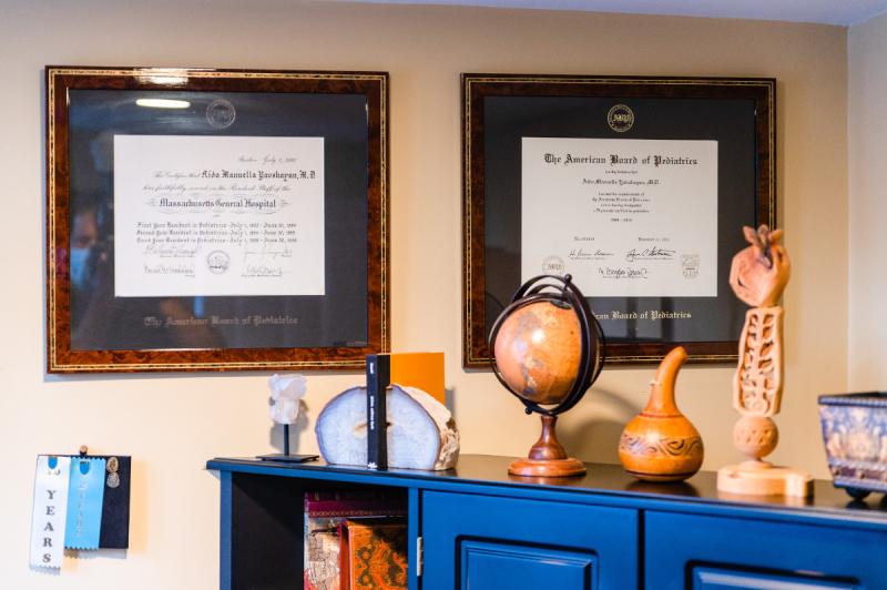 two diplomas hanging on the wall